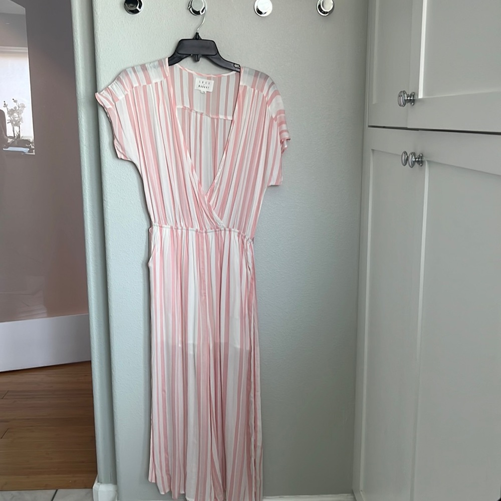 Lost and wander pink stripped jumpsuit. Size small 10/10 new without tags
